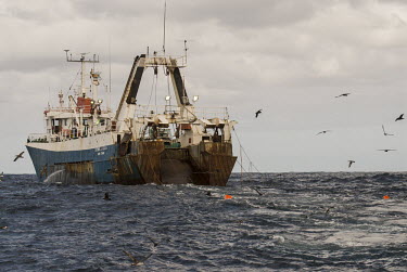 Large scale pelagic trawler towing tori-lines to scare seabirds Horizontal,Outdoors,Pelagic,Purse-sein fishing,africa,african,color image,colour image,commercial fishing,day,image,pelagic birds,photo,photography,tori-lines
