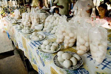 Eggs of yellow-headed sideneck turtle for sale at a market in Peru Threats to existence,Adult,Poaching,Eggs,unifilis,Reptilia,Chordata,Animalia,Podocnemididae,Wetlands,Vulnerable,South America,Streams and rivers,Omnivorous,Appendix II,Podocnemis,Testudines,Ponds and