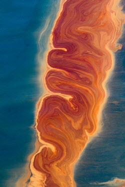 Winding and binding itself along a convergence area, this line of oil was sickly beautiful as it smothered life. oil,deepwater horizon,oil spill,offshore,Gulf of Mexico,gulf,coast,pollution,marine,crude,aerial,pattern,colour,colourful,environmental,disaster