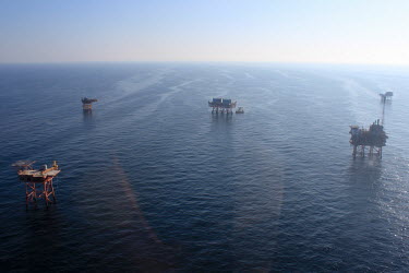 Oil rigs oil rig,platform,oil,drilling,sea,surface,aerial,misty,atmospheric,environmental