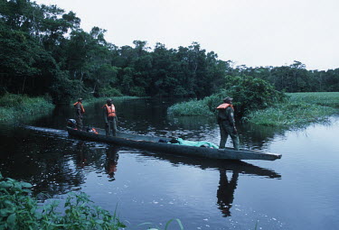 WWF International staff on patrol for poaching activities in North East Gabon Africa,conservation,conservation issue,conservation issues,patrol,patrols,boat,river,forest,ranger,rangers,WWF,staff,people,poaching,poachers,wildlife trade