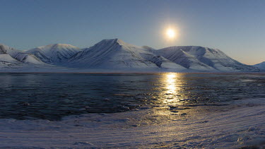 Svalbard landscape Svalbard,Arctic,sunset,low light,sun,water,relection,mountains,snow,ice,blue sky