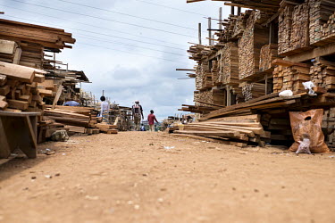 Monte�e Parc Wood Market africa,people,man,men,horizontal,timber,market,markets,commercial,cameroon,yaounde,wood market,seller,work,low angle,wood,deforestation