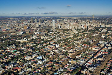Aerial view of Johannesburg city centre with highrise buildings in the background - Gauteng Province, South Africa Aerial,Skyline,City,High-rise,Pattern,Order,Block,Mountain,Urban sprawl,Tarmac,Road,Suburb