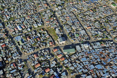 Aerial view of an informal settlement on the Cape Flats - Western Cape Province, South Africa Aerial,Informal settlement,Improvisation,Roofs,Rooftops,Colourful,Environment,Outside,Pattern,Order,Blocks,Square