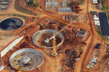 Aerial view of industrial development - Johannesburg, South Africa Aerial,Heavy industry,Land,Brown,Environmental issues,Fuel,Environment,Development,Crane,Building material