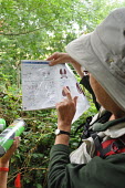 Volunteer demonstrating how to identify small mammal tracks Volunteer,survey,tracks,identify,identification