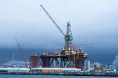 An Oil Rig that is undergoing maintenance lies within Cape Town Harbour African conservation photography,Coastline,Horizontal,Islands,Marine Parks Photographic Survey,South Africa,Western Cape,africa,african,color,colour,day,holiday destination,image,oil and gas,oil rig i