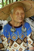 Potrait of a Dayak elder portrait,people,locals,elder,women,traditional,forest,rainforest,dayak,hat,straw hat,earings,ears,smile,woman