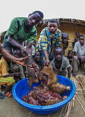 Bush meat in bowl in village Area of Lake Tumba,poaching,bush meat,hunting,illegal,local community,culture,traditions,project,WWF Congo,environmental issues,The Green Heart of Africa,people,village,meat,dead,Africa,Area del Lago