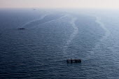 Platforms in sea oil rig,platform,oil,drilling,sea,surface,aerial,misty,atmospheric,environmental