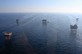 Oil rigs oil rig,platform,oil,drilling,sea,surface,aerial,misty,atmospheric,environmental