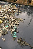Conservation Issues: polluted river in central Nairobi Africa,conservation,conservation issue,conservation issues,water,urban,village,waterway,waterways,polluted,pollution,slum,stream,dirt,dirty,filth,filthy,rubbish,plastic pollution,plastic,plastic bag,p