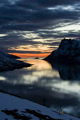 Dramatic landscape Troms,Tromso,Norway,sunset,low light,water,sky,snow,clouds,reflection,dark,moody,mountains,TromsNorway