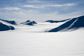 Light & Land Svalbard,Arctic,landscape,snow,light,white,snowscape,mountains,valley,negative space,wispy clouds,blue sky