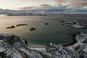 Tromso Coast Troms,coast,coastal,coastline,islands,islets,marine,Norway,oceans,rocks,sea,seascape,clouds,snow,winter,Troms,Tromso