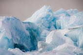 Glacier ice Arctic,glacier ice,sea ice,ice,snow,Svalbard,winter,blue,dark clouds,abstract,close up
