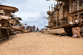 MonteÌe Parc Wood Market africa,people,man,men,horizontal,timber,market,markets,commercial,cameroon,yaounde,wood market,seller,work,low angle,wood,deforestation