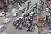 Too much motorized traffic in India causes chaos on the inadequate road system city,urban,dirty,traffic,human,humans,people,person,roads,road,car,vehicles,climate change,built environment,scooters,scooter,electricity wire,electricity,City Life,On the move,Direction,Chaos