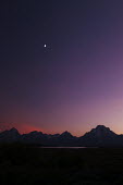 The purple sky over Grand Teton National Park landscape,moonlight,purple,pink,silhouette,shadow,night,night time,midnight,sky,night sky,mountain,mountains,Grand Teton,dusk