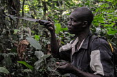 Anti-poaching team patrolling a forest, Uganda