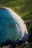 Aerial view of La Digue island - Seychelles saltwater,Marine,saline,Aquatic,water,water body,tropics,Tropical,Sea,seas,shoreline,Shore,sea shore,shoreland,sea side,Sky,beaches,Beach,environment,ecosystem,Habitat,blue skies,sunny,Blue sky,bright