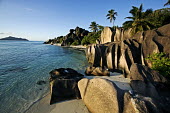 Granite boulders on the coast of La Digue - Seychelles shoreline,Shore,sea shore,shoreland,sea side,tropics,Tropical,blue skies,sunny,Blue sky,bright,environment,ecosystem,Habitat,saltwater,Marine,saline,Sky,Sea,seas,coast,Coastal,coast line,coastline,Aqu