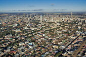 Aerial view of Johannesburg city centre with highrise buildings in the background - Gauteng Province, South Africa Martin Harvey Aerial,Skyline,City,High-rise,Pattern,Order,Block,Mountain,Urban sprawl,Tarmac,Road,Suburb