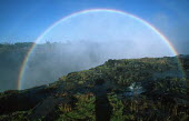 Clear rainbow over Victoria Falls - Zimbabwe Aerial,Waterfall,Spectacular,Light,Mist,Spray,Landscape,Formation,Geological,Water,River,Cliff,Rainbow