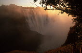Victoria Falls at sunrise - Zimbabwe Waterfall,Spectacular,Sunrise,Light,Mist,Spray,Landscape,Formation,Geological,Water,River,Cliff