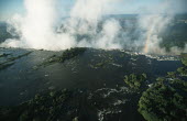 Aerial view of Victoria Falls - Zimbabwe Aerial,Waterfall,Spectacular,Light,Mist,Spray,Landscape,Formation,Geological,Water,River,Cliff,Rainbow