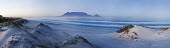 Panoramic view of Blouberg beach with Table Mountain in background - Western Cape Province, South Africa Panoramic,Coastal,Beach,Sanddunes,Sea,Ocean,Long-exposure,Blue,Morning,Table Mountain,Clear sky
