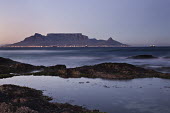 Table Mountain at sunrise - South Africa Table Mountain,Iconic,Landscape,Sunrise,Lights,Bay,Ocean,Rocky shore,Long exposure,View