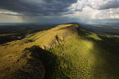 Aerial view of the Magaliesburg mountains with stormclouds overhead - South Africa Storm clouds,Rain,Storm,Dark sky,Grey,Sunbeam,Mountain,Mountain range