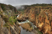 A view down a canyon with mist rising in the background - South Africa Viewpoint,View,Cliff,Canyon,Boulder,Narrow,Landscape,Formation,Mist,Adventure,River,Trees