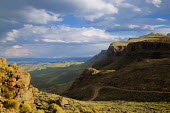 A clear view from the Sani pass road - uKhahlamba Drakensberg Park, South Africa no people,horizontal,day,front view,Africa,African,Southern Africa,scenic,scenery,beauty in nature,natural world,non-urban scene,nature,outdoors,Road,Winding,Cliff,Valley,Landscape