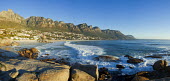 View of Camps Bay with the view of the Twelve Apostles mountain range - Cape Town, South Africa Aerial,Coastal,Town,Beach,Sand,Mountain,Cliff,Settlement,Civilisation,Ocean,Sea,Bluesky