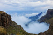 The view from the Sani pass road with low clouds - uKhahlamba Drakensberg Park, South Africa no people,horizontal,day,front view,Africa,African,Southern Africa,scenic,scenery,beauty in nature,natural world,non-urban scene,nature,outdoors,Low cloud,Cloud formation,Valley,Rock formation,Landsca
